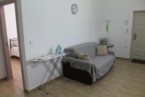 A bed or beds in a room at HAROULENA