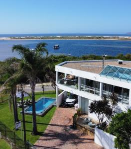 an aerial view of a house with a swimming pool at Sunshowers Plett in Plettenberg Bay