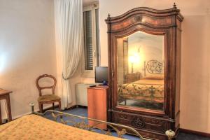 Posteľ alebo postele v izbe v ubytovaní Hotel Torcolo "Residenze del Cuore"