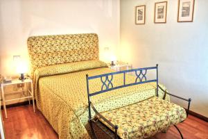 Posteľ alebo postele v izbe v ubytovaní Hotel Torcolo "Residenze del Cuore"