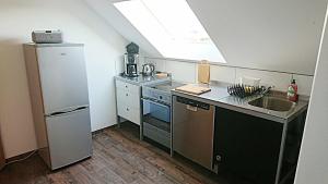 a small kitchen with a sink and a refrigerator at Ferienwohnung Edermündung in Haldorf