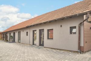 a row of modular buildings on a brick street at Apartament TANGO la casa PIANO HOUSE ,cu parcare in Alba Iulia