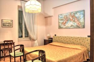 Posteľ alebo postele v izbe v ubytovaní Hotel Torcolo "Residenze del Cuore"