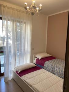 Ένα ή περισσότερα κρεβάτια σε δωμάτιο στο La casa di Luana sulla via Francigena
