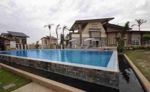 a large swimming pool in front of a house at La Casa Felice in Angeles