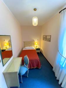 Posteľ alebo postele v izbe v ubytovaní Hotel Torcolo "Residenze del Cuore"