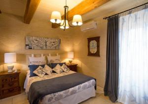 Кровать или кровати в номере Betty Cake B&B