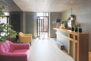 Posezení v ubytování L'Aptois Hôtel