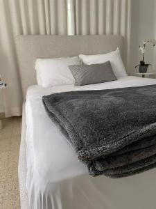 En eller flere senge i et værelse på Mar Báltico