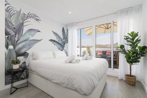 Posteľ alebo postele v izbe v ubytovaní Suite Homes Penthouse Capuchinos