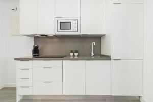 Kuchyňa alebo kuchynka v ubytovaní Suite Homes Penthouse Capuchinos
