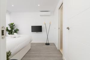 Posteľ alebo postele v izbe v ubytovaní Suite Homes Penthouse Capuchinos