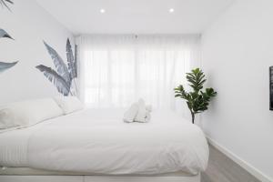 Posteľ alebo postele v izbe v ubytovaní Suite Homes Penthouse Capuchinos