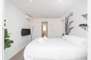Posteľ alebo postele v izbe v ubytovaní Suite Homes Penthouse Capuchinos