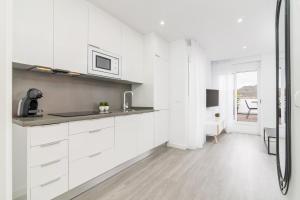 Kuchyňa alebo kuchynka v ubytovaní Suite Homes Penthouse Capuchinos
