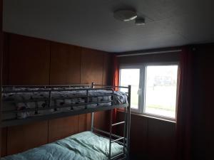 Postel nebo postele na pokoji v ubytování A-frame volledig vrijstaande woning