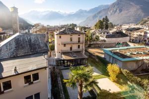 an aerial view of a city with mountains in the background at Villa Giade in Chiavenna