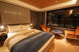 Rúm í herbergi á Asakusa Kokono Club Hotel