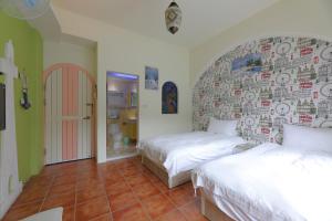 Postel nebo postele na pokoji v ubytování Rainbow B&B