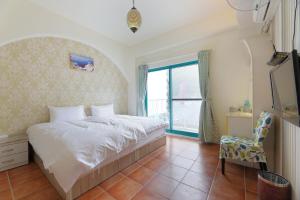 Postel nebo postele na pokoji v ubytování Rainbow B&B