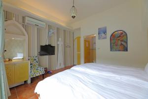 Postel nebo postele na pokoji v ubytování Rainbow B&B