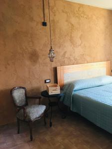 Ένα ή περισσότερα κρεβάτια σε δωμάτιο στο B&B Casa Egle