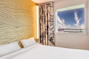 Postel nebo postele na pokoji v ubytování B&B HOTEL Brest Centre Port de Commerce