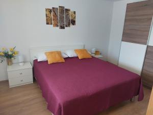 Postel nebo postele na pokoji v ubytování Apartmani Ana
