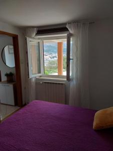 Postel nebo postele na pokoji v ubytování Apartmani Ana