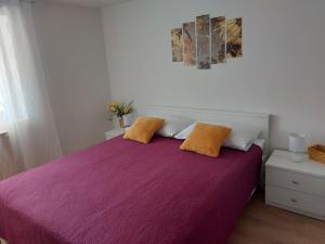 Postel nebo postele na pokoji v ubytování Apartmani Ana