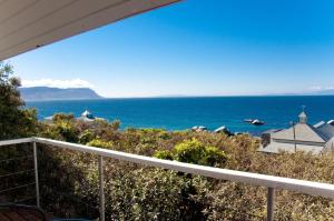 a view of the ocean from the balcony of a house at Sail Away Studios in Simonʼs Town