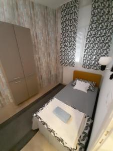 Postel nebo postele na pokoji v ubytování Apartman Centar 2