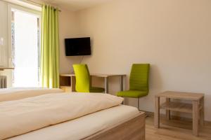 En eller flere senge i et værelse på Landgasthof Zum Wolfsberg