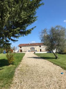 a view of the house from the driveway at La Grange bnb in Yviers