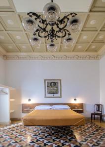Posteľ alebo postele v izbe v ubytovaní DOMUS ALERIA Deluxe Rooms