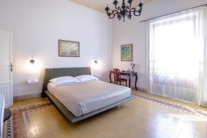 Posteľ alebo postele v izbe v ubytovaní DOMUS ALERIA Deluxe Rooms