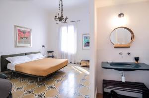 Posteľ alebo postele v izbe v ubytovaní DOMUS ALERIA Deluxe Rooms