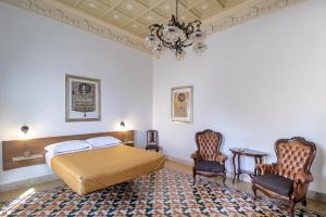 Posteľ alebo postele v izbe v ubytovaní DOMUS ALERIA Deluxe Rooms