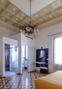 Posteľ alebo postele v izbe v ubytovaní DOMUS ALERIA Deluxe Rooms