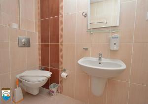 a bathroom with a toilet and a sink at BODENSEE HOTEL in Antalya