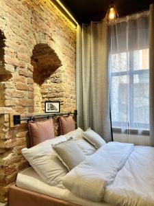 Posteľ alebo postele v izbe v ubytovaní Pudrowy Apartament OLD TOWN design