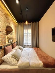 Posteľ alebo postele v izbe v ubytovaní Pudrowy Apartament OLD TOWN design