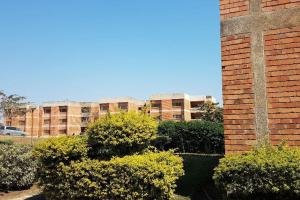 a cross on the side of a brick building at Ibex Hill Apartment- Power backup in Lusaka