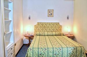 Posteľ alebo postele v izbe v ubytovaní Hotel Torcolo "Residenze del Cuore"