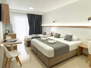 מיטה או מיטות בחדר ב-Villa Millene