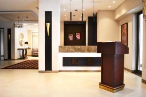 a lobby of a hotel with a podium at Ambassador, a Boutique Hotel in Amman +89 photos