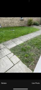 a walkway with a grassy yard and a sidewalk sidx sidx sidx at Spacious Double Room in prime location London in London