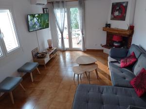 a living room with a couch and a table at Can Eugeni in L'Escala