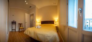 Posteľ alebo postele v izbe v ubytovaní Cosy Catedral Ha Apartment