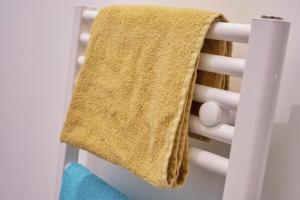 a towel hanging on the back of a chair at ❂ Les Logis de la Trémoille ❂ Cozy ❂ Netflix ❂ in Thouars